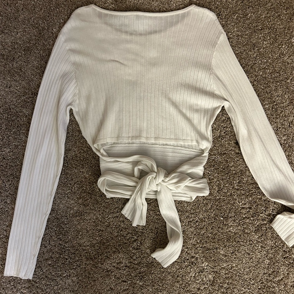 white long sleeve, bow tie in the back